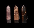Set of crystals stones rose quartz, tiger eye, golden sandstone isolated on black Royalty Free Stock Photo