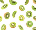 Set with cut ripe kiwi fruits falling on white background Royalty Free Stock Photo