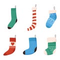 Set of cute Christmas socks for gifts, flat vector illustration isolated on white background. Royalty Free Stock Photo