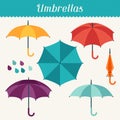 Set of cute multicolor umbrellas in flat design