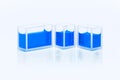 Set of cuvettes with blue liquid Royalty Free Stock Photo