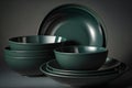 Set of dark green ceramic bowls. Deep soup dishes in moody dark light. Kitchenware shining porcelain meal green pottery Royalty Free Stock Photo