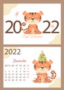 Set - December 2022 calendar and cover. Cute tiger cub with a Christmas tree, toys and garlands. horizontal A4 template. Week Royalty Free Stock Photo