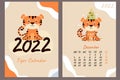 Set - December 2022 calendar and cover. Cute tiger cub with a Christmas tree, toys and garlands. Year of the Tiger in Chinese or