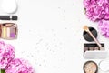 Set of decorative cosmetics mascara powder lipstick eyeshadow blush makeup brush pink hydrangea flowers star confetti on light Royalty Free Stock Photo