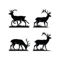Set of Deer Silhouettes with Antlers Standing and Grazing on Grass Royalty Free Stock Photo
