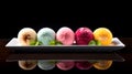 Set of delicious colorful mochi on a plate. Variety of fresh, healthy food on black background