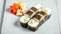 Set of delicious fresh sushi rolls served on a white plate Royalty Free Stock Photo