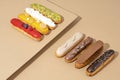 set of delicious glazed donuts in a variety of flavors, arranged on a cardboard paper in an inviting display