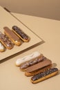 set of delicious glazed donuts in a variety of flavors, arranged on a cardboard paper in an inviting display