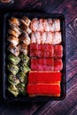 A set of delicious sushi rolls, sushi rolls in a disposable large set