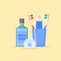 Set of dental cleaning tools. Toothbrushes and toothpaste in glass, mouthwash, dental floss. Royalty Free Stock Photo