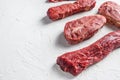 Set of denver, top blade, tri tip steak, machete, flank, bavette London broil marble beef on white background side view close up Royalty Free Stock Photo