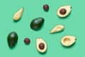 Set for designer from avocado pieces. Collection whole and half avocados and avocadoÃ¢â¬â¢s seeds for design isolated on green Royalty Free Stock Photo