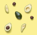 Set for designer from avocado pieces. Collection whole and half avocados and avocadoÃ¢â¬â¢s seeds for design isolated on yellow Royalty Free Stock Photo