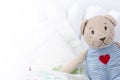 Set of diapers for newborn in basket with love bear toy. Baby cl Royalty Free Stock Photo