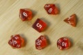 Set of dice for fantasy dnd and rpg tabletop games Board game polyhedral dices with different sides on wooden background Royalty Free Stock Photo