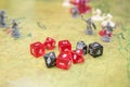 Set of dices and game miniatures on the green battlefield. Role play dungeons and dragons