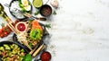 Set of diet dishes. Assortment of food on white wooden background. Top view.