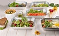 Set of diet dishes in containers on a light wooden background. Takeaway. Diet and healthy food