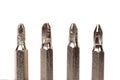 A set of different attachments for a head screwdriver with a screwdriver on a white background Royalty Free Stock Photo