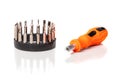 A set of different attachments for a head screwdriver with a screwdriver on a white background Royalty Free Stock Photo