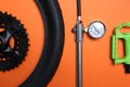 Set of different bicycle parts and manometer on background, flat lay