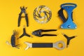 Set of different bicycle tools and part on color background