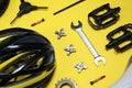 Set of different bicycle tools and parts on background, above view