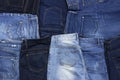 Set of different blue jeans top view flat lay. Detail of nice blue jeans. Jeans texture or denim background. Trend clothing.
