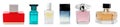 Set with different bottles of perfume on background, banner design Royalty Free Stock Photo