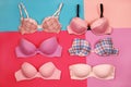 Set of different bras on multicolored background Royalty Free Stock Photo