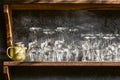 Set of different champagne, wine, martini empty clean glasses on bar shelf Royalty Free Stock Photo