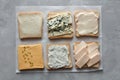 Set of different cheeses on toasts