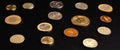 Set of different coins on a black background. Stock photo assortment of coins of different countries