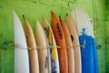 Set of different color surf boards in a stack by ocean.Bali,Indonesia. Surf boards on sandy Weligama beach. On Weligama beach surf