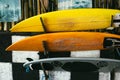 Set of different color surf boards in a stack by ocean.Bali,Indonesia. Surf boards on sandy Weligama beach. On Weligama beach surf