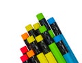 Set of different colored wood pencil crayons with colorful rubber attached in the back Royalty Free Stock Photo