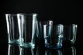 Set of different colorful  glasses on black background Royalty Free Stock Photo