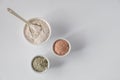 Set of different cosmetic clay mud powders on white background Royalty Free Stock Photo