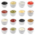 Set of different delicious sauces on white