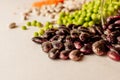 A set of different dried legumes is in glass cups and is a little scattered: red lentils, green peas, red beans, white beans. Royalty Free Stock Photo