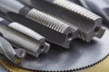 Set of different drill bits,thread tap and mill cutters with caliper ruler on steel plate background. Locksmithing deal Royalty Free Stock Photo