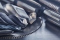 Set of different drill bits,thread tap and mill cutters on steel plate background. Locksmithing deal