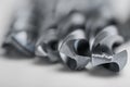 Set of different drill bits on white background Royalty Free Stock Photo