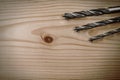 Set of different drill bits on wooden background Royalty Free Stock Photo