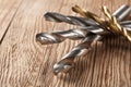 Set of different drill bits on wooden background Royalty Free Stock Photo