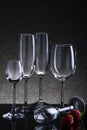 Set with different empty glasses on black background Royalty Free Stock Photo