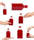 set of different Glass bottle with red tincture with hand. isolated on white background. Alcohol problem Royalty Free Stock Photo