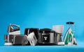 Set of different household appliances on blue background Royalty Free Stock Photo